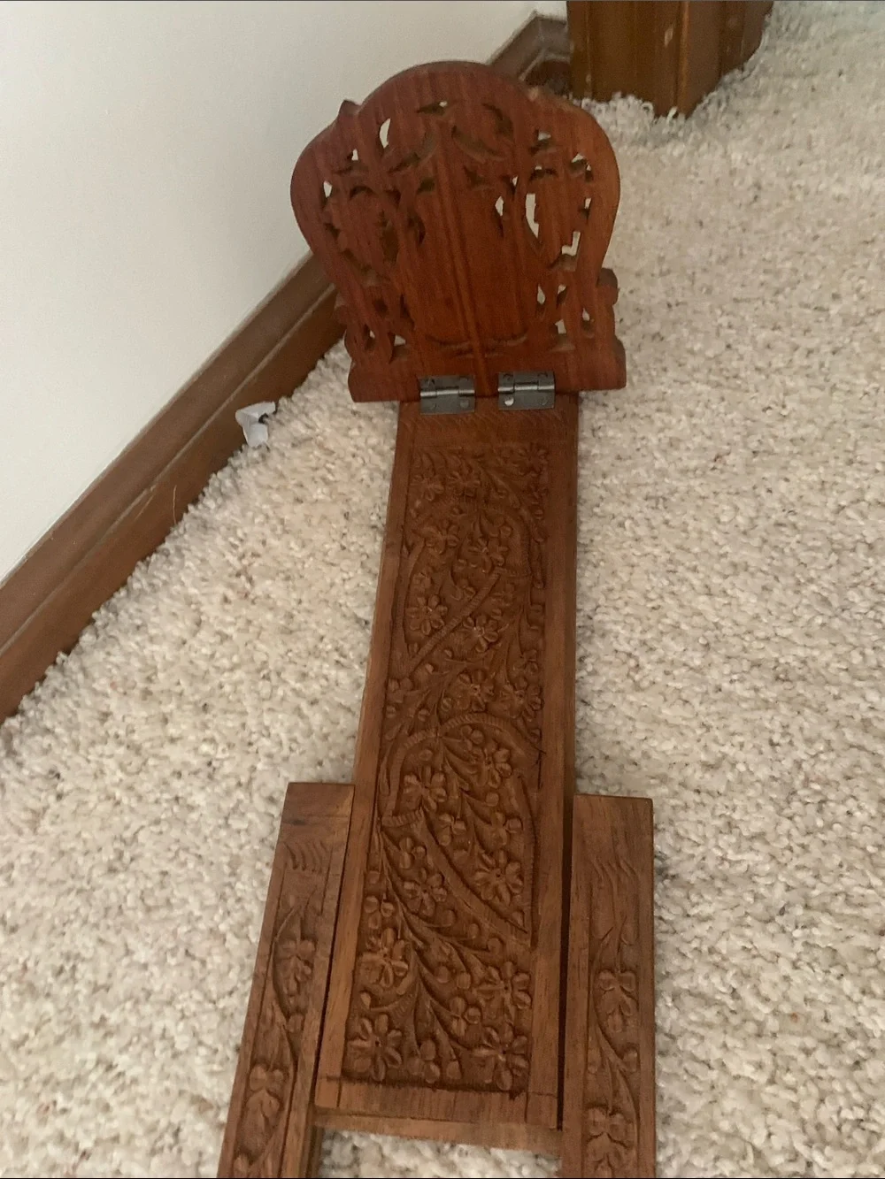 Vintage hand carved expanding book rack.